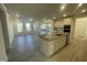 Bright, open-concept kitchen features a granite island, stainless steel appliances, and ample natural light at 1504 Maelyn Way, Fuquay Varina, NC 27526