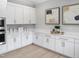 White kitchen with quartz countertops and gold hardware at 2524 Silas Peak Ln, Apex, NC 27523