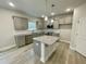 Modern kitchen with gray cabinets, granite countertops and island at 339 Bishop Ln, Sanford, NC 27330