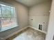 Laundry room with window and shelving at 339 Bishop Ln, Sanford, NC 27330