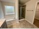 Main bathroom with soaking tub, shower and double vanity at 339 Bishop Ln, Sanford, NC 27330