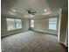 Spacious main bedroom with carpet, tray ceiling and multiple windows at 339 Bishop Ln, Sanford, NC 27330