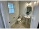 Small half bathroom with pedestal sink and toilet at 339 Bishop Ln, Sanford, NC 27330