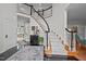 Grand foyer with winding staircase, black tile floor, and stylish decor at 4600 Scottland Dr, Mebane, NC 27302