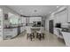 Modern kitchen featuring an island with seating, stainless steel appliances and lighting at 4600 Scottland Dr, Mebane, NC 27302