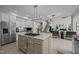 Open concept kitchen with stainless steel appliances and adjacent seating area at 4600 Scottland Dr, Mebane, NC 27302
