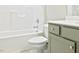 Bathroom with modern vanity and a tiled shower-tub combo at 727 Putney Hill Rd, Zebulon, NC 27597