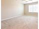 Bright bedroom with neutral walls, carpet, ceiling fan and a large window for natural light at 727 Putney Hill Rd, Zebulon, NC 27597