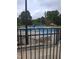 Community pool area surrounded by a fence and lounge chairs at 727 Putney Hill Rd, Zebulon, NC 27597