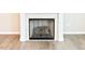 Living area fireplace with light mantel and hearth, perfect for cozy nights in at 727 Putney Hill Rd, Zebulon, NC 27597