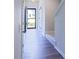 Inviting entryway and hallway with stairs leading to the upper level at 727 Putney Hill Rd, Zebulon, NC 27597