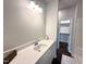 Bathroom featuring a vanity, sink, and access to the walk-in closet at 215 Britt St, Smithfield, NC 27577