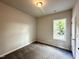 Minimalist bedroom with carpet and window view of the property at 215 Britt St, Smithfield, NC 27577