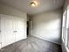 Light and bright carpeted bedroom with closet at 215 Britt St, Smithfield, NC 27577