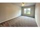 A light-filled bedroom with a ceiling fan and ample space at 215 Britt St, Smithfield, NC 27577