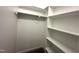 Compact walk-in closet with carpeted flooring and shelving at 215 Britt St, Smithfield, NC 27577