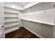 Walk-in closet with white shelving for optimal storage and organization at 215 Britt St, Smithfield, NC 27577
