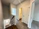 Upstairs hallway with hardwood flooring, bathroom access, and view of downstairs at 215 Britt St, Smithfield, NC 27577