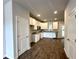 Modern kitchen features white cabinets, granite countertops, and stainless-steel appliances at 215 Britt St, Smithfield, NC 27577