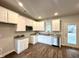 Close view of kitchen with white cabinets, granite counters, stainless appliances, and exterior door at 215 Britt St, Smithfield, NC 27577