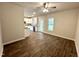 Open floorplan transitions to a kitchen with bright cabinets, and stainless appliances at 215 Britt St, Smithfield, NC 27577