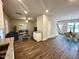 Open-concept living room with hardwood floors, modern furnishings, and ample natural light at 215 Britt St, Smithfield, NC 27577