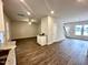 Bright living room features recessed lighting and hardwood floors, transitioning to dining area at 215 Britt St, Smithfield, NC 27577