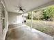 Covered patio with ceiling fan, overlooking the backyard at 215 Britt St, Smithfield, NC 27577