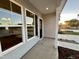 Covered front porch with a view of the sunset at 215 Britt St, Smithfield, NC 27577