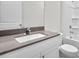 Bathroom features a modern sink with a quartz countertop and a shower at 1304 Jasmine View Way, Knightdale, NC 27545
