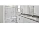 Modern bathroom features dual vanity, glass-enclosed shower and updated fixtures at 1304 Jasmine View Way, Knightdale, NC 27545
