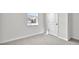 Bright bedroom with neutral carpet and white trim at 1304 Jasmine View Way, Knightdale, NC 27545