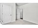 Carpeted bedroom with white trim and neutral walls at 1304 Jasmine View Way, Knightdale, NC 27545