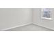Sunlit bedroom with neutral carpet and white trim at 1304 Jasmine View Way, Knightdale, NC 27545