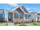Charming two-story home with blue siding, brick accents, and a well-manicured front yard at 1304 Jasmine View Way, Knightdale, NC 27545