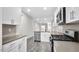 Spacious modern kitchen features stainless steel appliances and ample counter space at 1304 Jasmine View Way, Knightdale, NC 27545