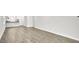 Spacious living room with hardwood floors, light gray walls, and access to the kitchen at 1304 Jasmine View Way, Knightdale, NC 27545