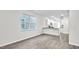 Bright living room with hardwood floors, light gray walls, and open kitchen at 1304 Jasmine View Way, Knightdale, NC 27545