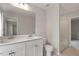 Well-lit bathroom featuring double sinks, a clean toilet, and a tub at 80 Bold Dr, Youngsville, NC 27596