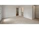 Bedroom with soft carpet and a view of the second floor hallway and bathroom at 80 Bold Dr, Youngsville, NC 27596