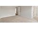 Spacious bedroom showcasing neutral paint and carpet, and a doorway to another room at 80 Bold Dr, Youngsville, NC 27596