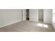 Bright bedroom featuring neutral carpet, paint, and ample natural light at 80 Bold Dr, Youngsville, NC 27596