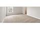 Bedroom with neutral carpet, paint, walk-in closet and window with a view at 80 Bold Dr, Youngsville, NC 27596