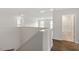 Hallway on second floor with wood flooring and bathroom with tile floor at 80 Bold Dr, Youngsville, NC 27596