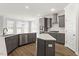 Open kitchen with an island, stainless steel appliances, and plenty of counter space at 80 Bold Dr, Youngsville, NC 27596