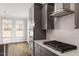 Modern kitchen with stainless steel appliances, herringbone backsplash, and gas cooktop at 80 Bold Dr, Youngsville, NC 27596