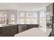 Bright kitchen featuring an island, quartz countertops, stainless steel appliances, and backyard views at 80 Bold Dr, Youngsville, NC 27596