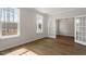 Office features beautiful wood-look floors, glass French doors, and lots of light at 80 Bold Dr, Youngsville, NC 27596