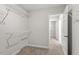 Walk-in closet with carpet and multiple wire shelves for optimal storage space at 80 Bold Dr, Youngsville, NC 27596