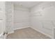 Walk-in closet with carpet and multiple shelves for optimal storage space at 80 Bold Dr, Youngsville, NC 27596